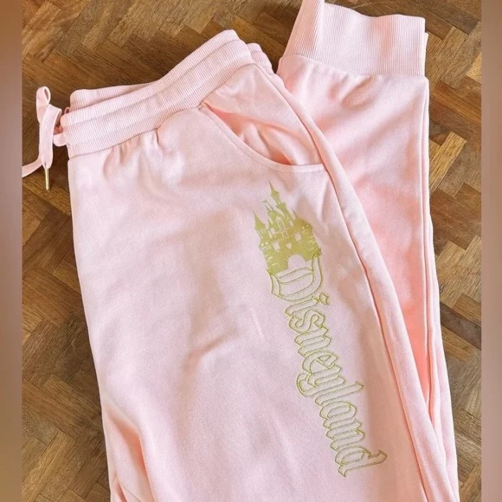 NWOT DISNEYLAND Women's Medium Peach Pink Gold Castle Embroidered Joggers